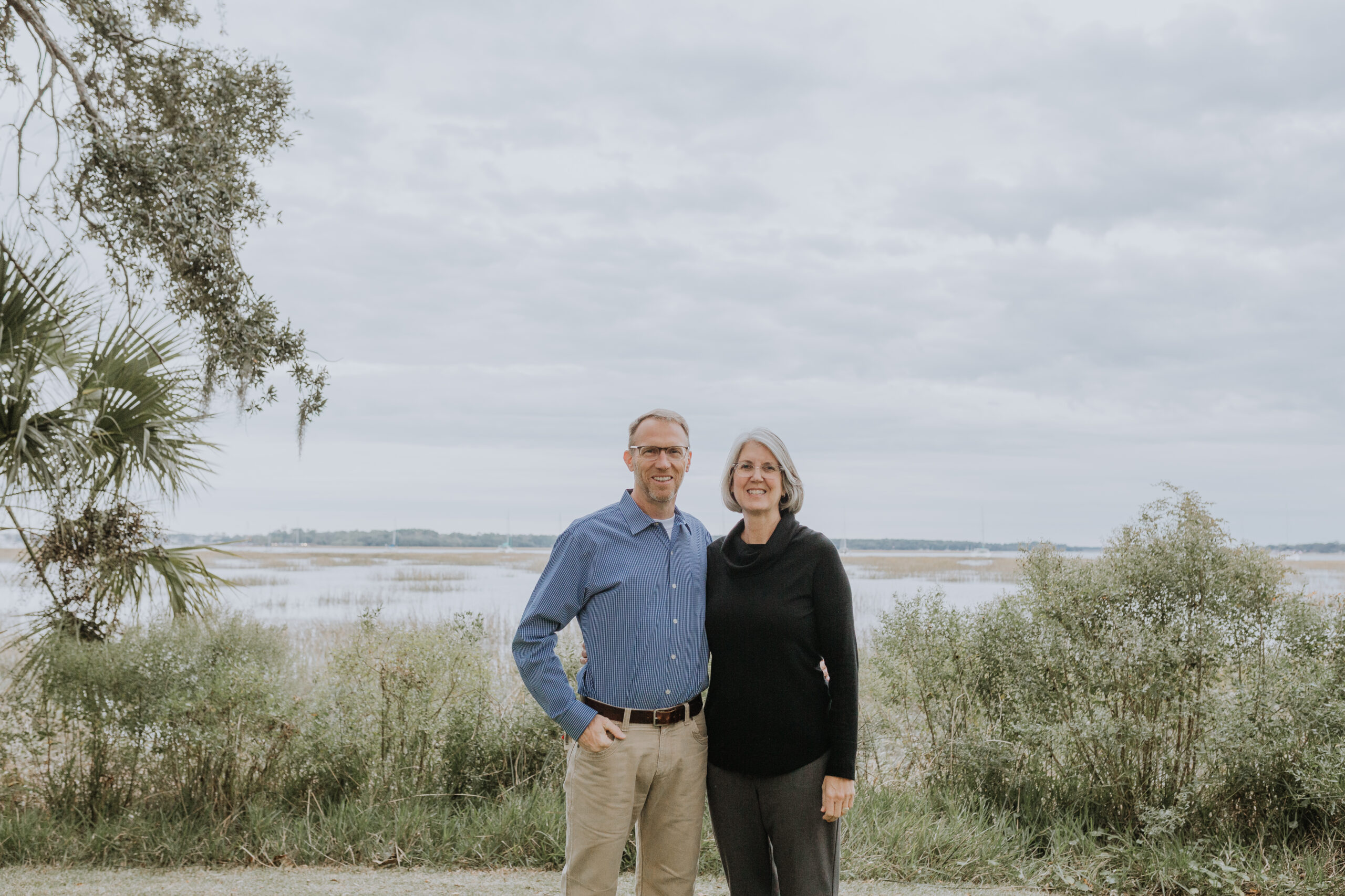 Grey Haired Couple in front of the Bay in Beaufort SC on an overcast day